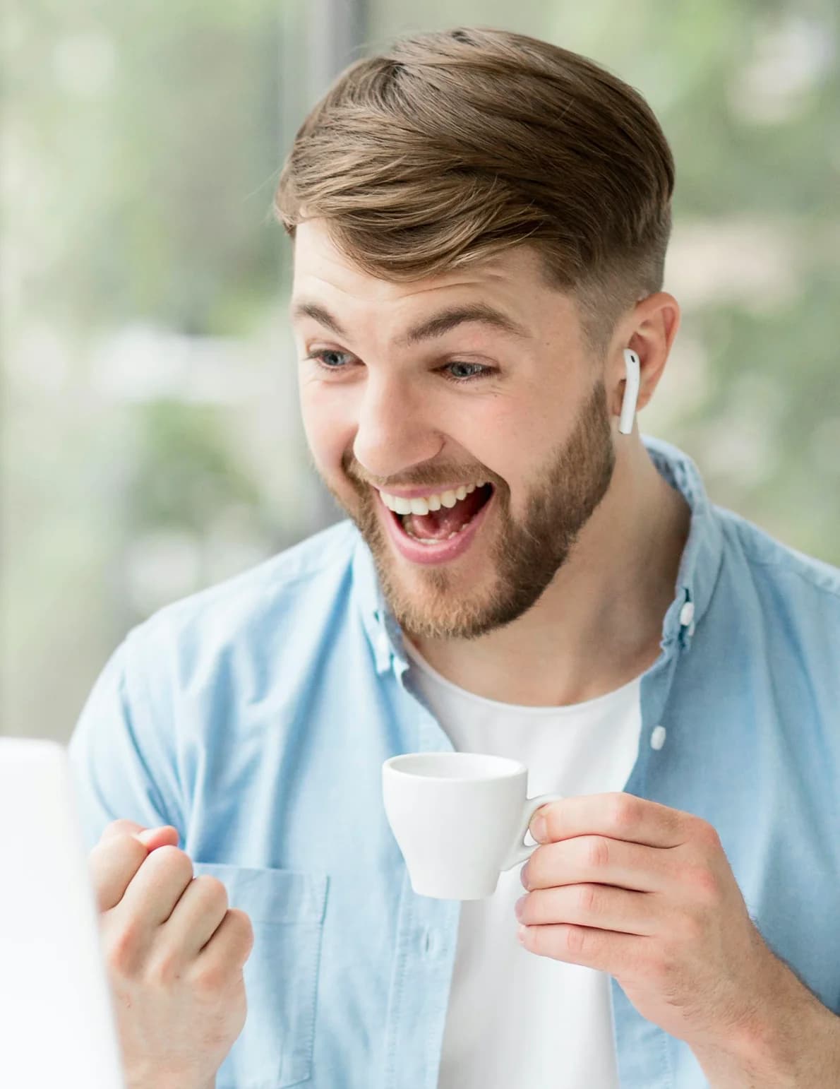 smiling man with airpods.webp